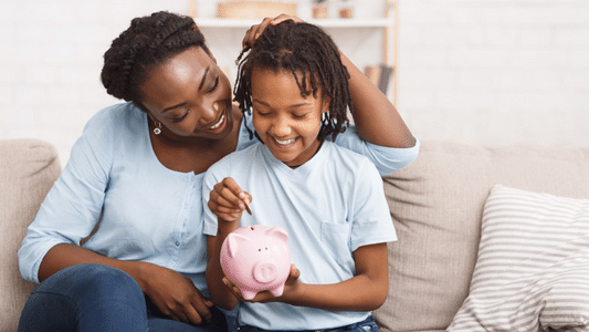parent and child interacting and holding a piggy bank