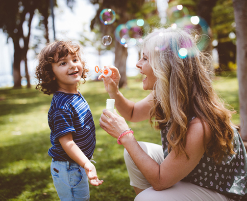 Woman and Child Blowing Bubbles