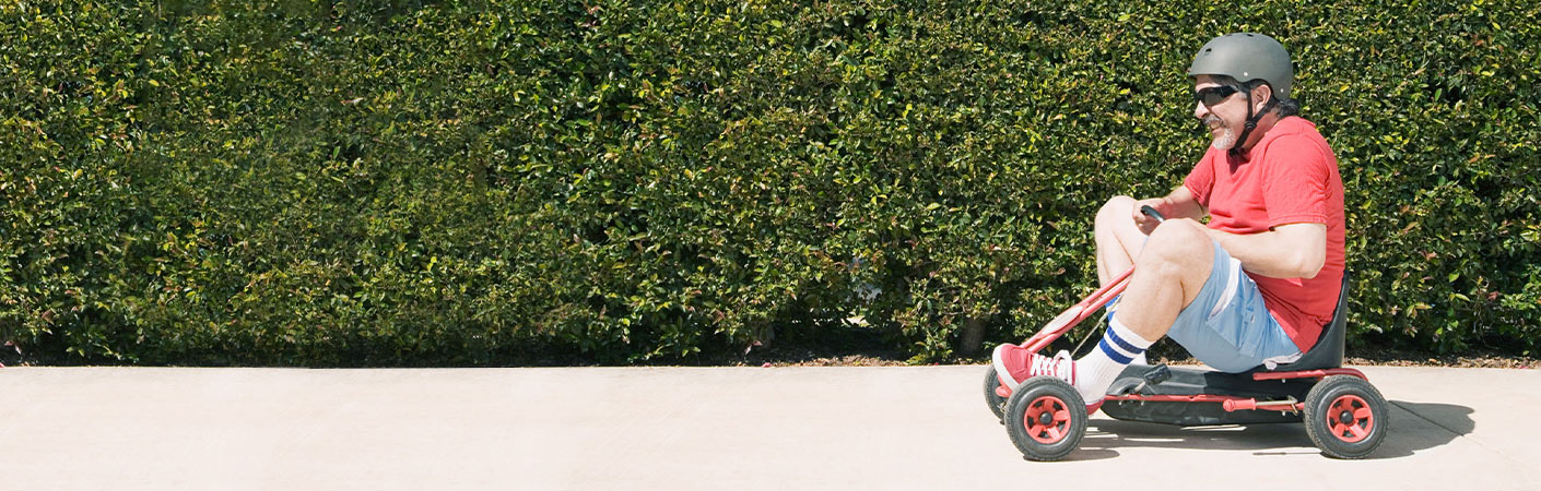 gentleman on child's toy vehicle